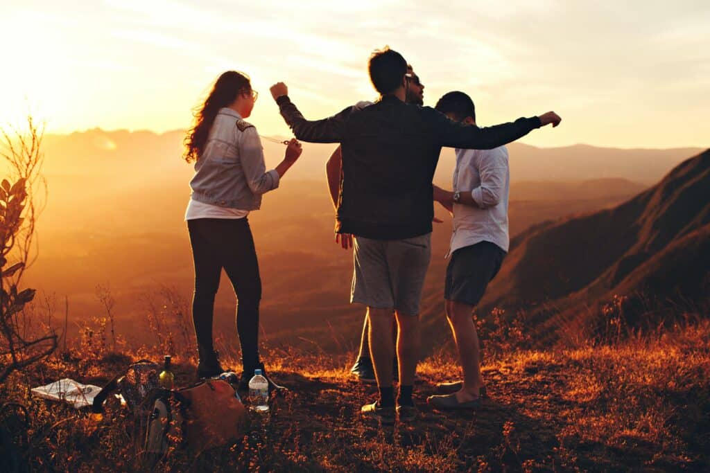 Photo by Helena Lopes: https://www.pexels.com/photo/four-person-standing-at-top-of-grassy-mountain-697244/