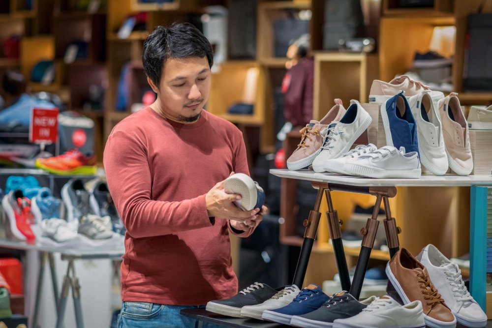 man shopping for shoes in china