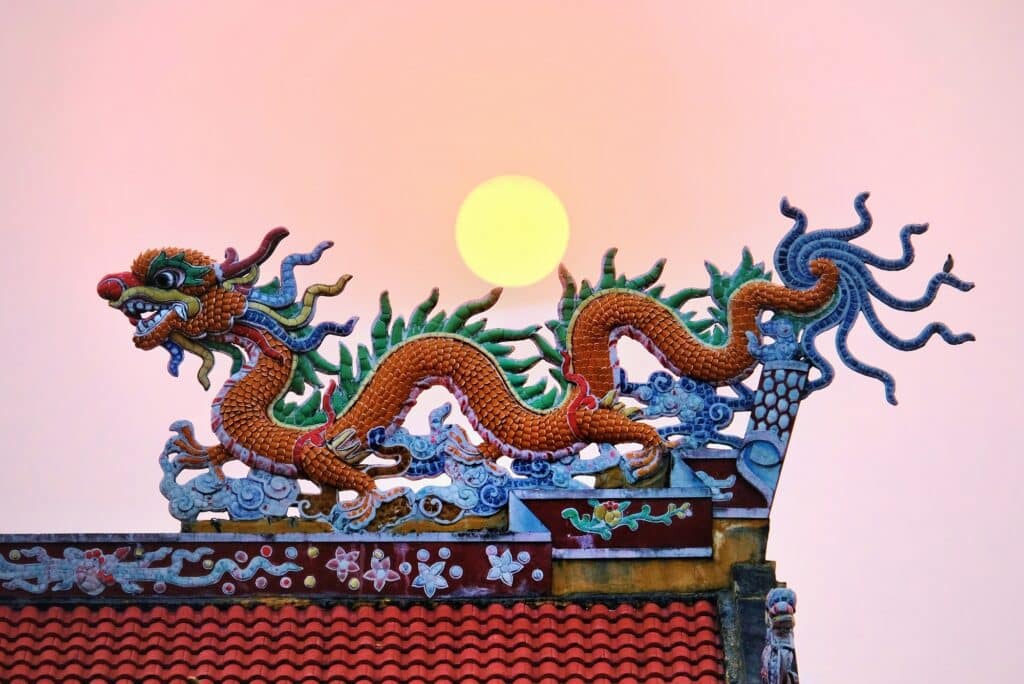 chinese-dragon-on-a-roof-with-a-sunset