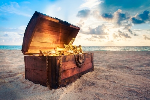 Treasure chest sitting in the sand on a beach