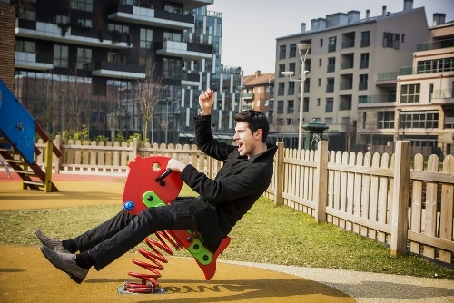 Man having fun on playground equipment