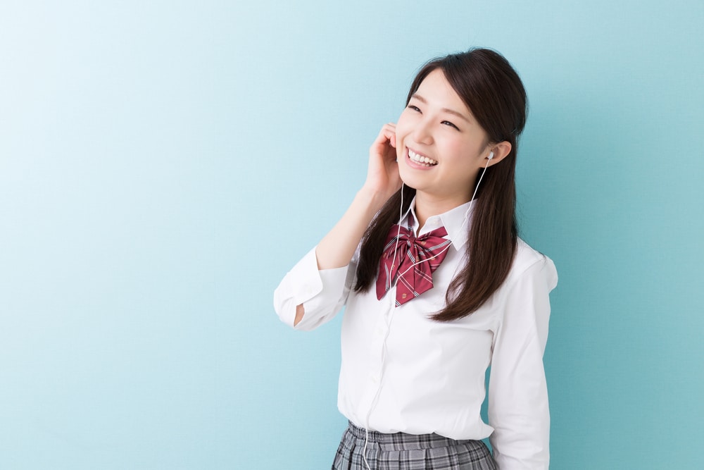 Asian-school-girl-listening-to-music