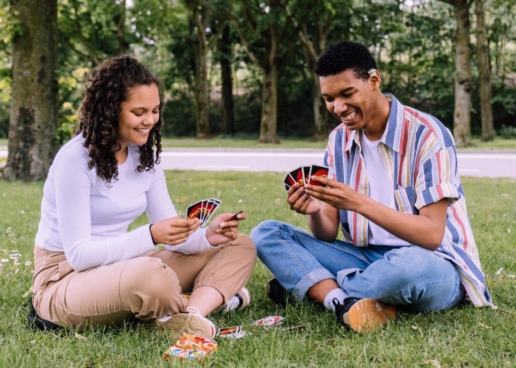 Photo by Steshka Willems: https://www.pexels.com/photo/man-and-woman-sitting-on-grass-playing-cards-2981571/