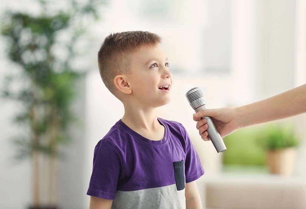 child practicing english speaking with a microphone
