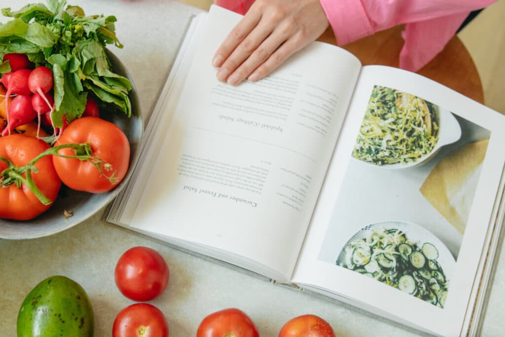 Vegetables next to a recipe book