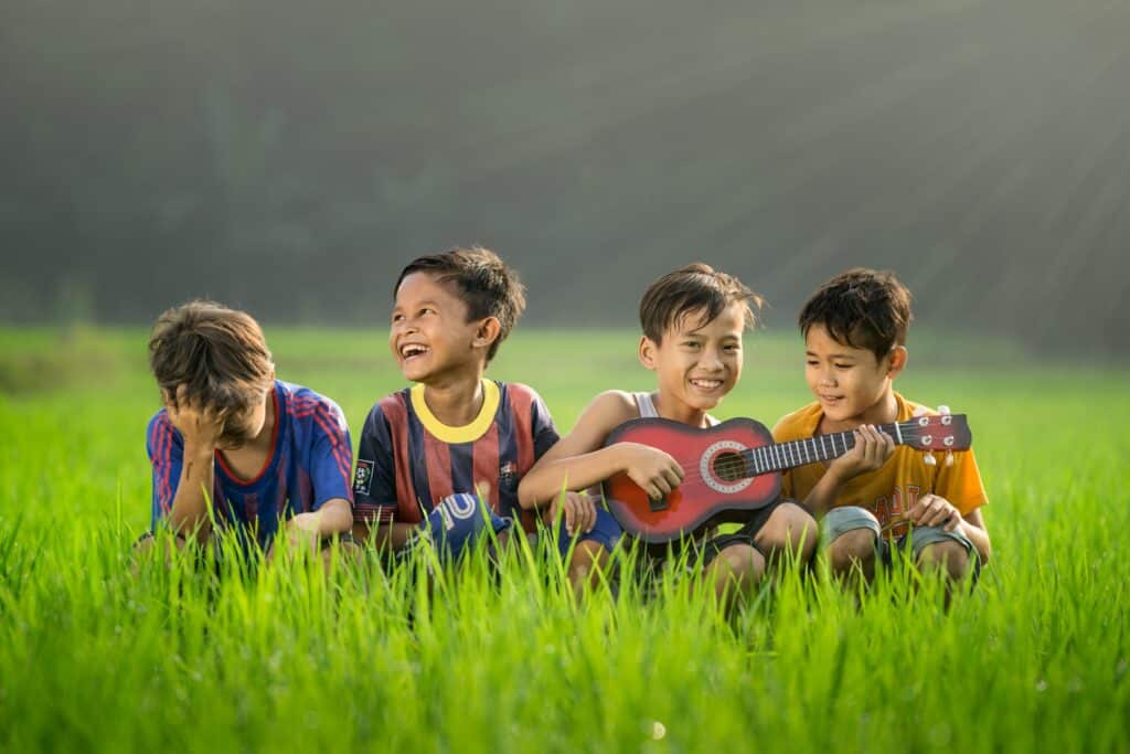 A group of kids outside singing together