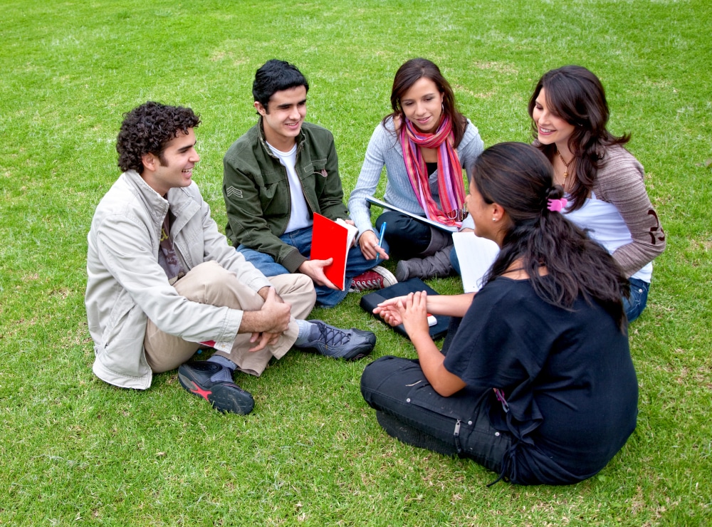 Group-of-students-sitting-in-circle-outdoors