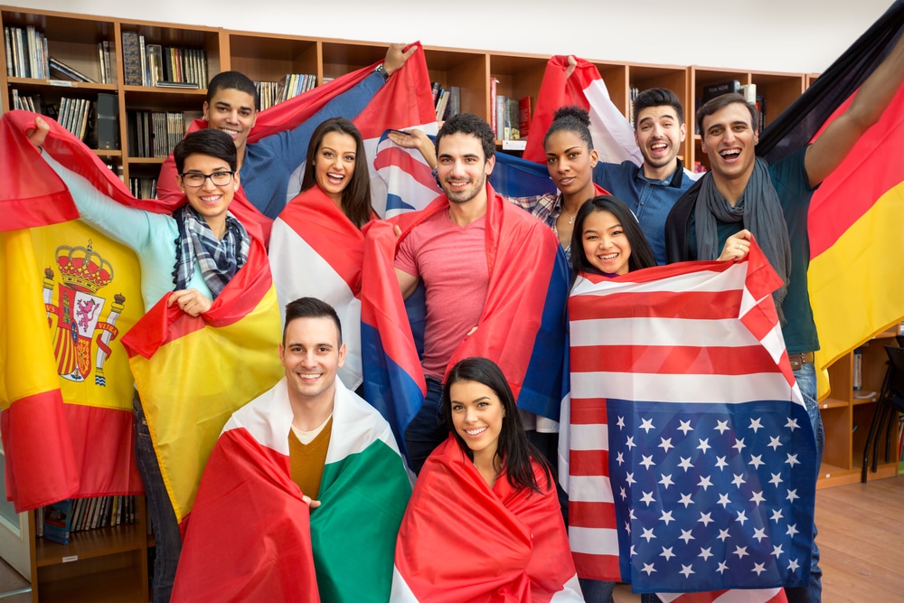 international students holding their own flags