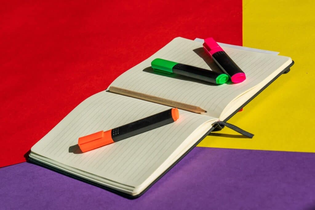 Notebook and set of highlighters