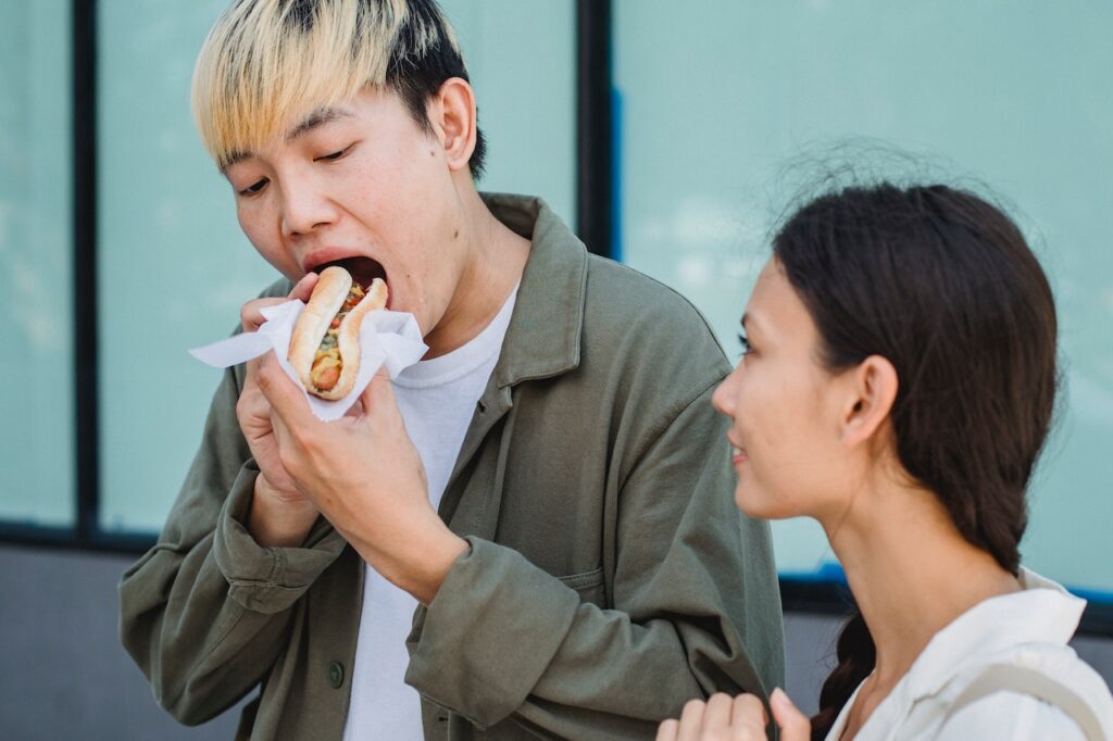 boy eating a hotdog