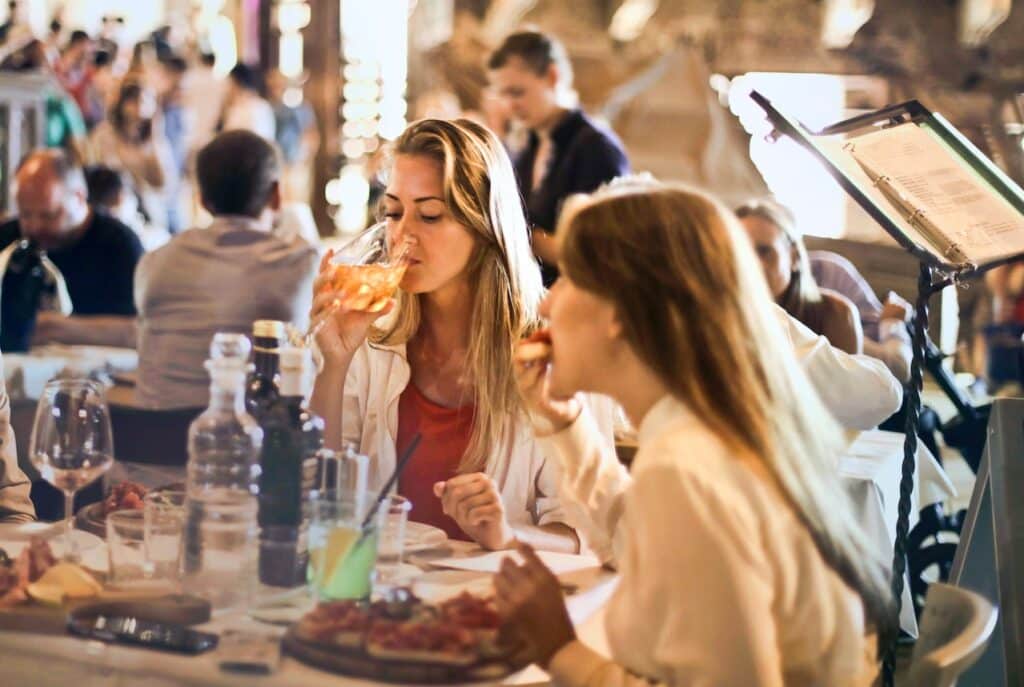 Two friends eating in a restaurant