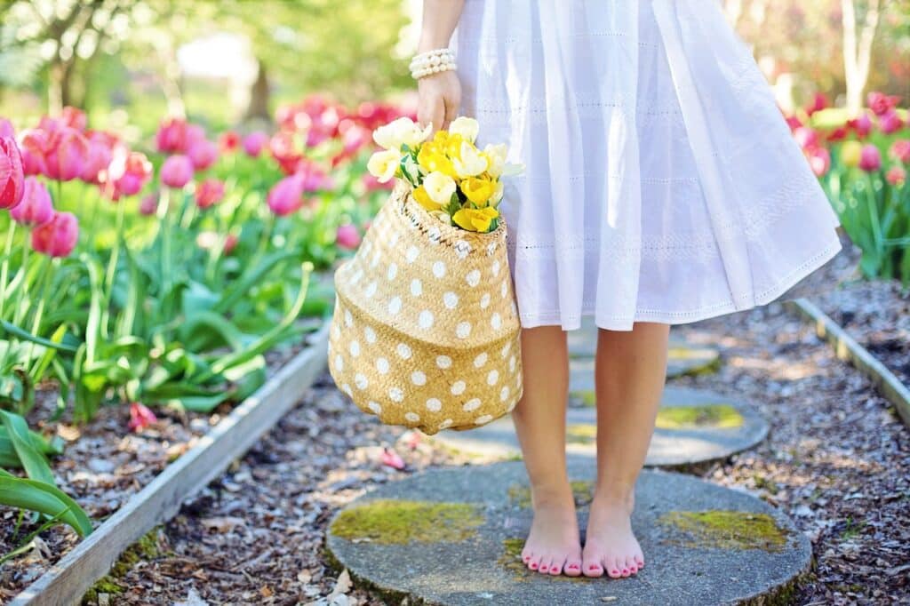 Barefoot person with flowers