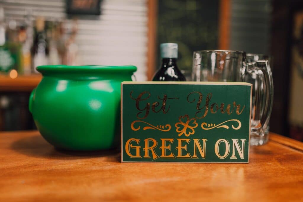 A green pot and a sign