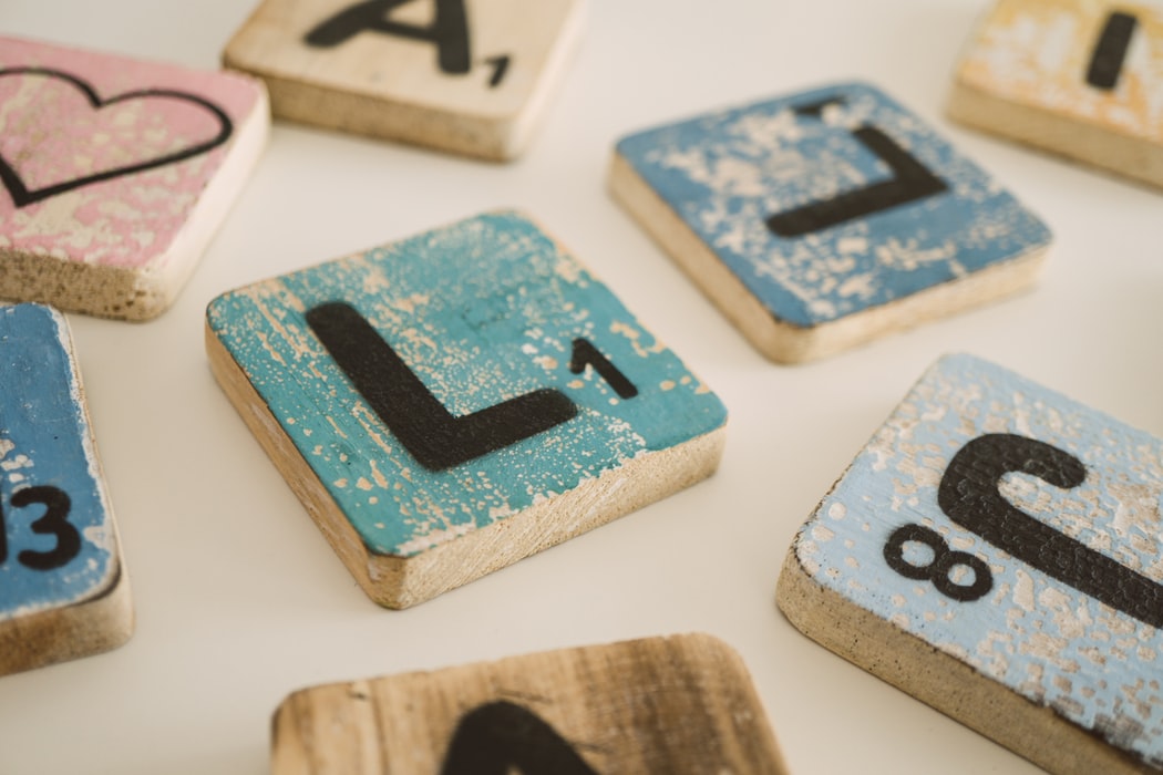 multicolored-scrabble-tiles-with-the-letter-l-at-the-center