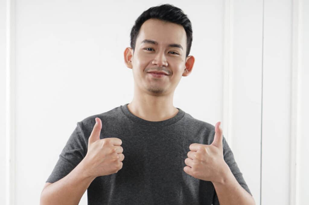 Man showing thumbs up to the camera