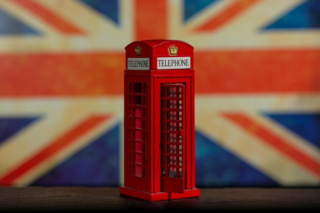 picture-of-a-red-telephone-box-in-front-of-a-british-flag