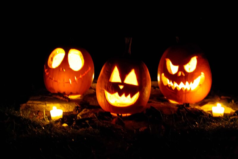 Three jack-o-lantern pumpkins on Halloween