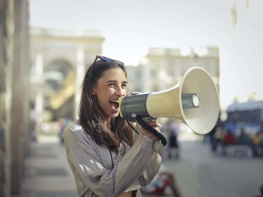 girl speaking into a megaphone