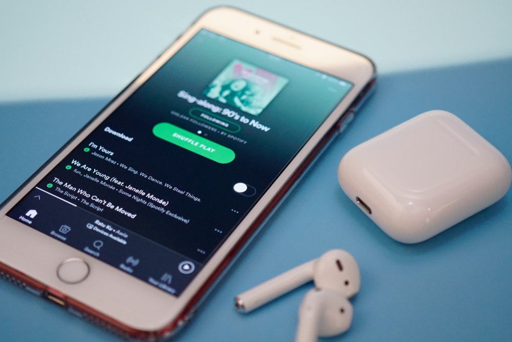 Spotify on smart phone with headphones