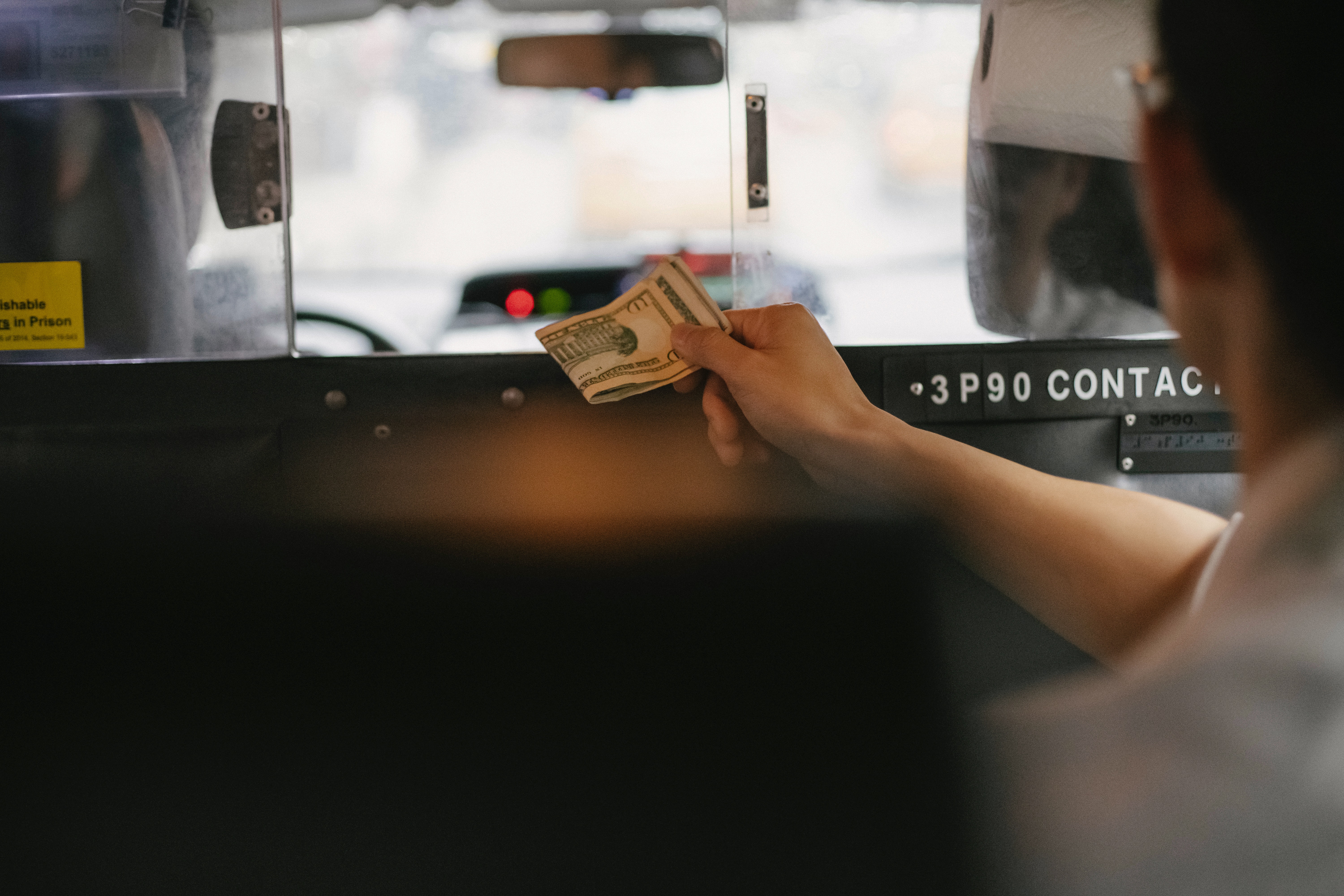 Photo by Tim  Samuel: https://www.pexels.com/photo/customer-paying-for-taxi-service-in-dollars-5835257/