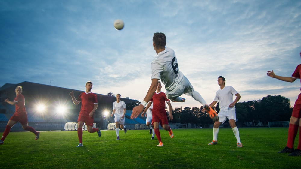 soccer-player-kicking-ball