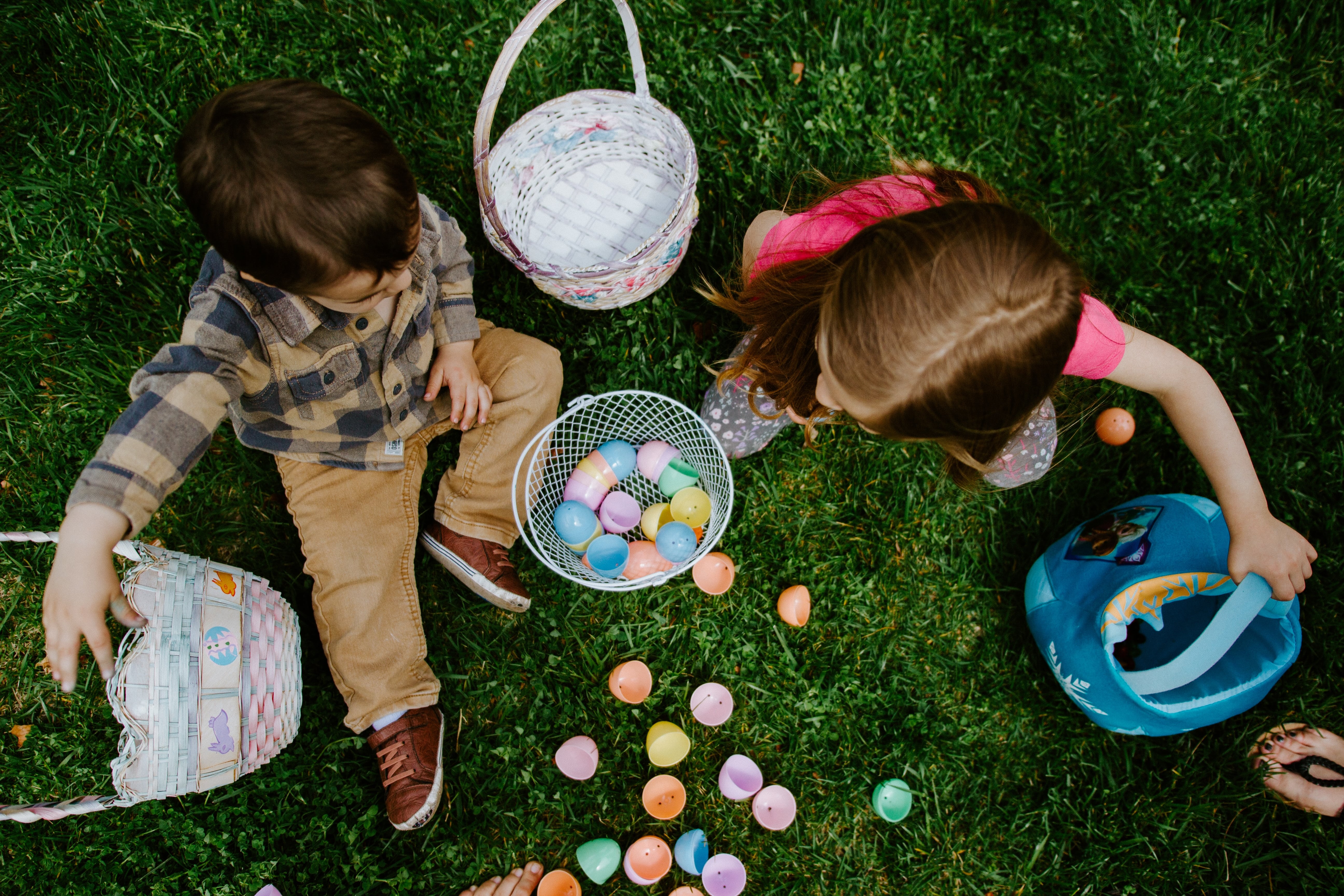 Two children explore their Easter baskets
