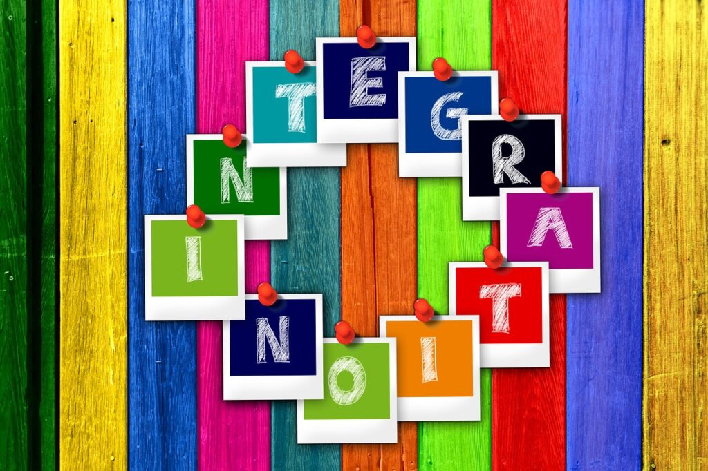 multicolored-squares-with-letters-spelling-out-integration-running-clockwise-against-multicolored-background