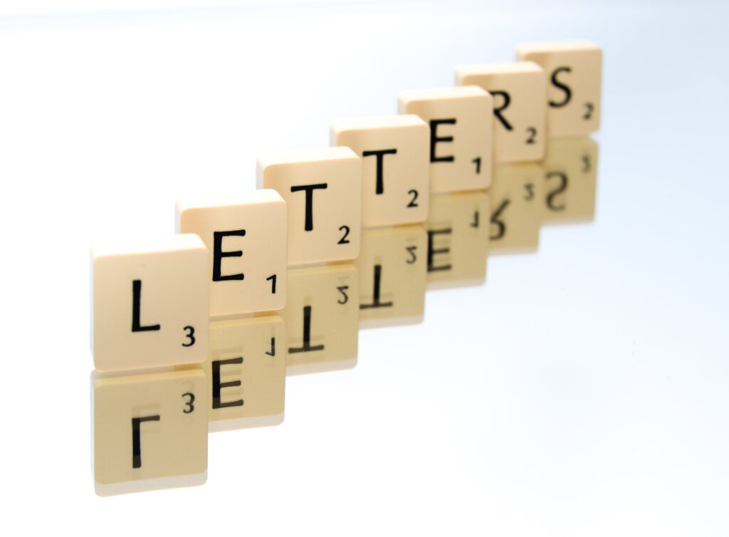 scrabble-tiles-forming-the-word-letters-positioned-diagonally-on-reflective-surface