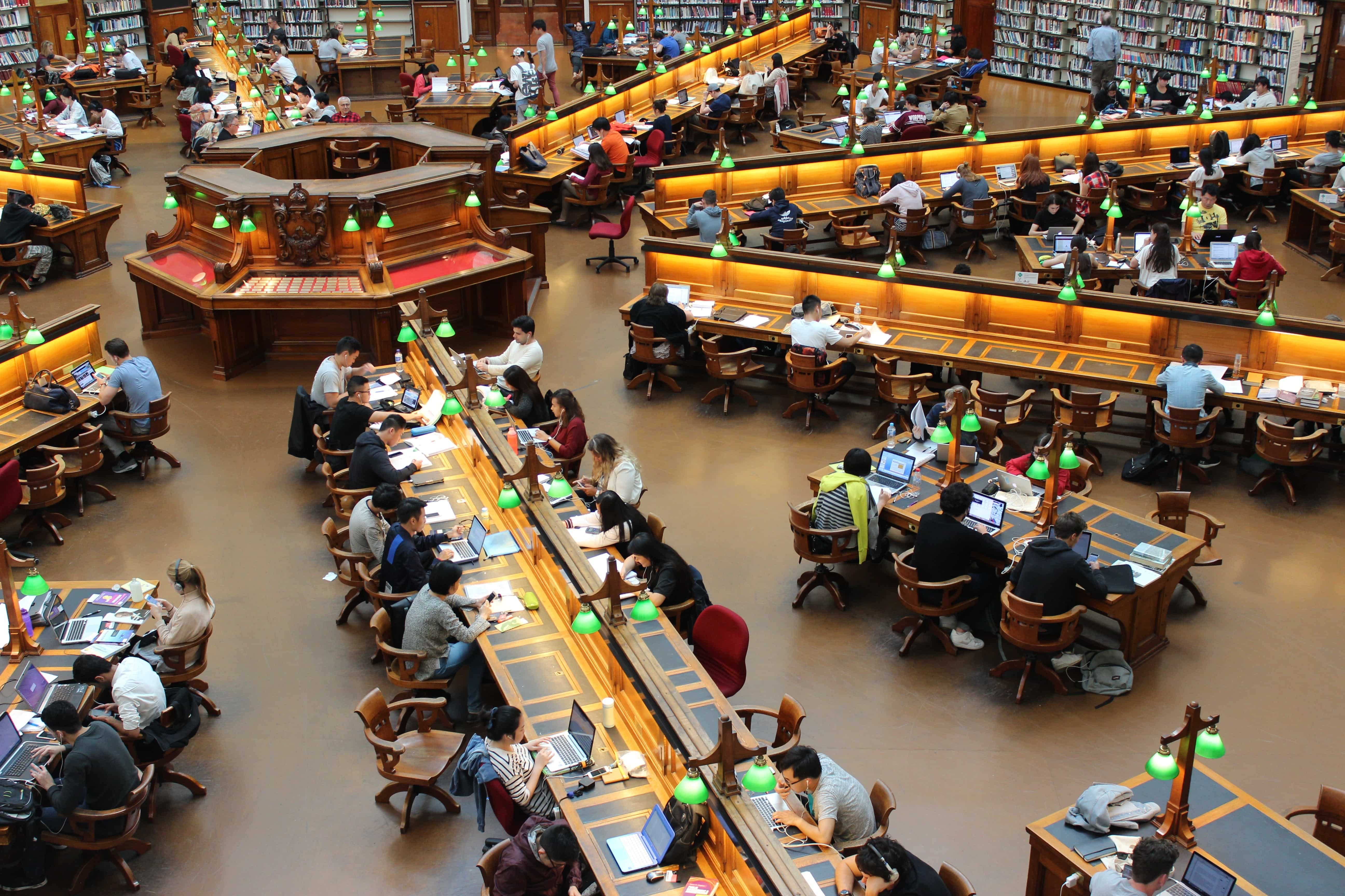 Students studying in a large university library