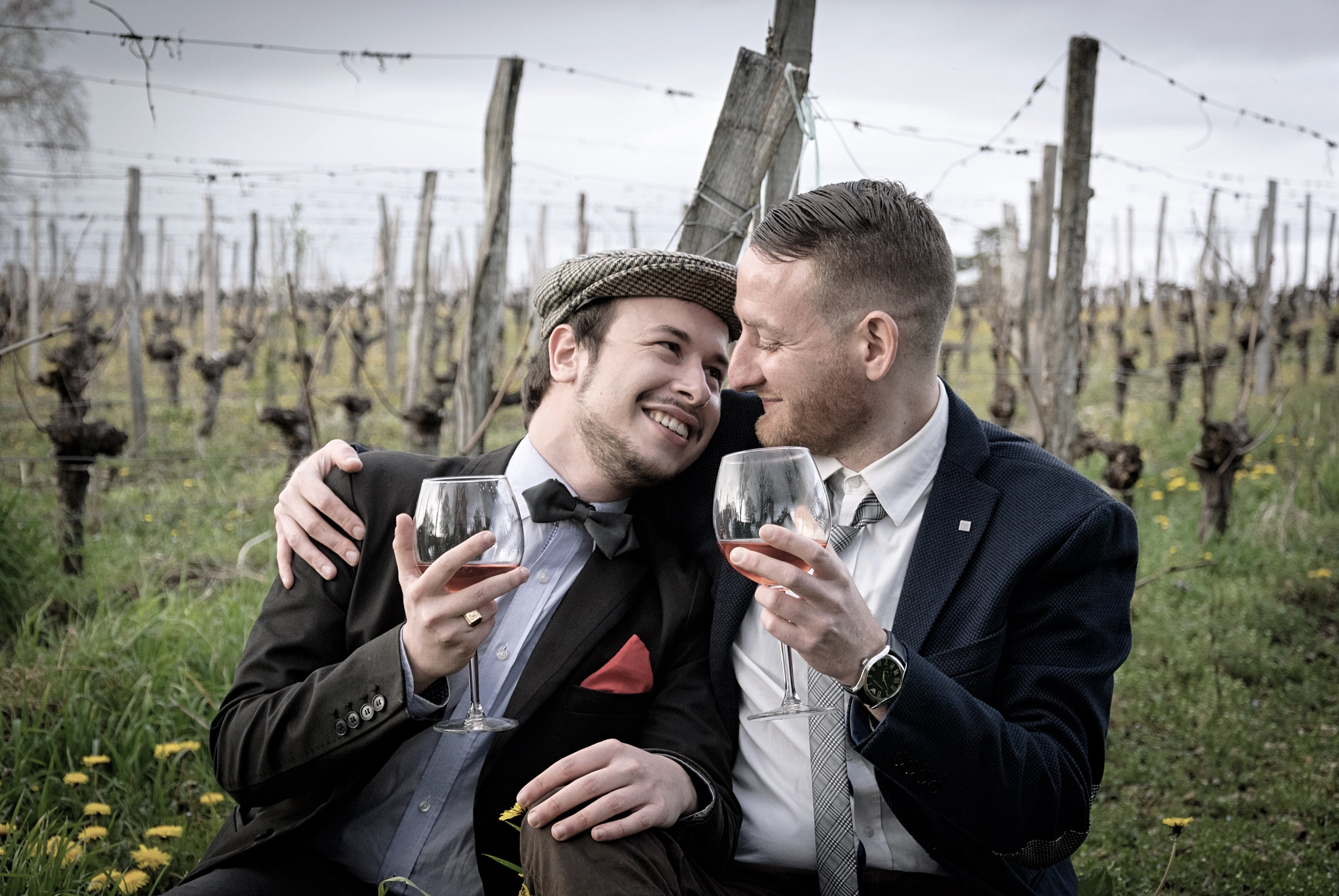 A couple embraces in a wine vinyard