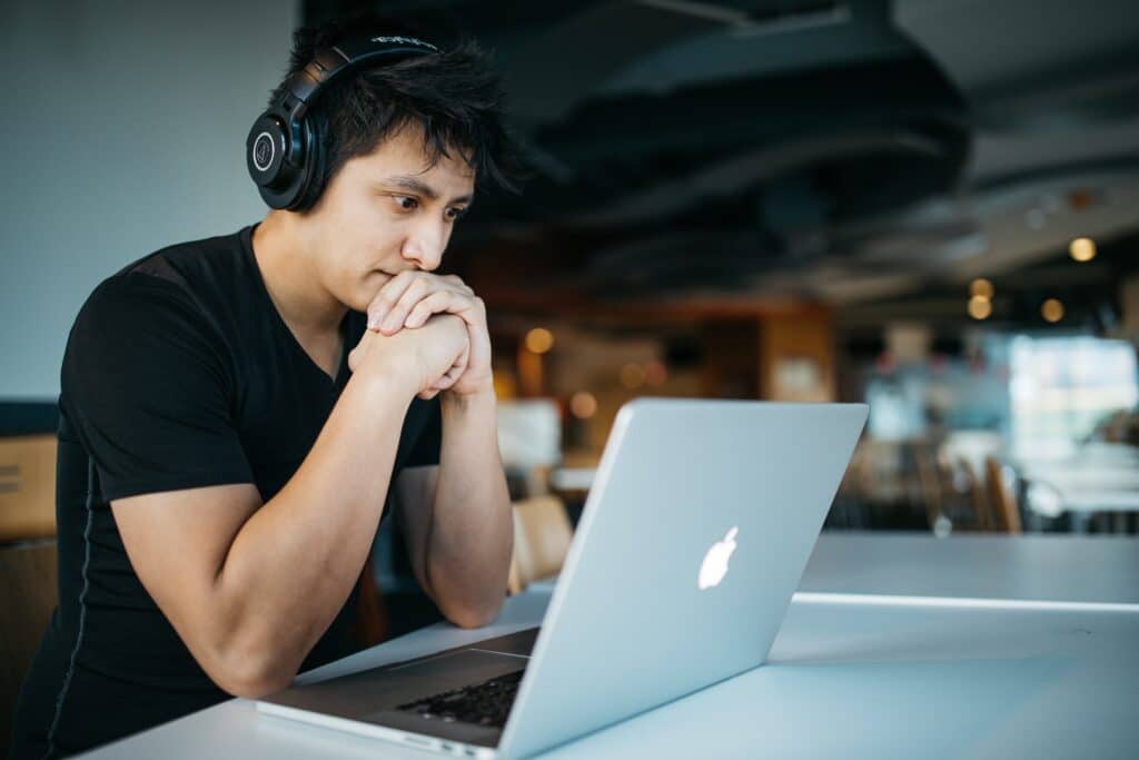 young-man-watching-something-on-laptop