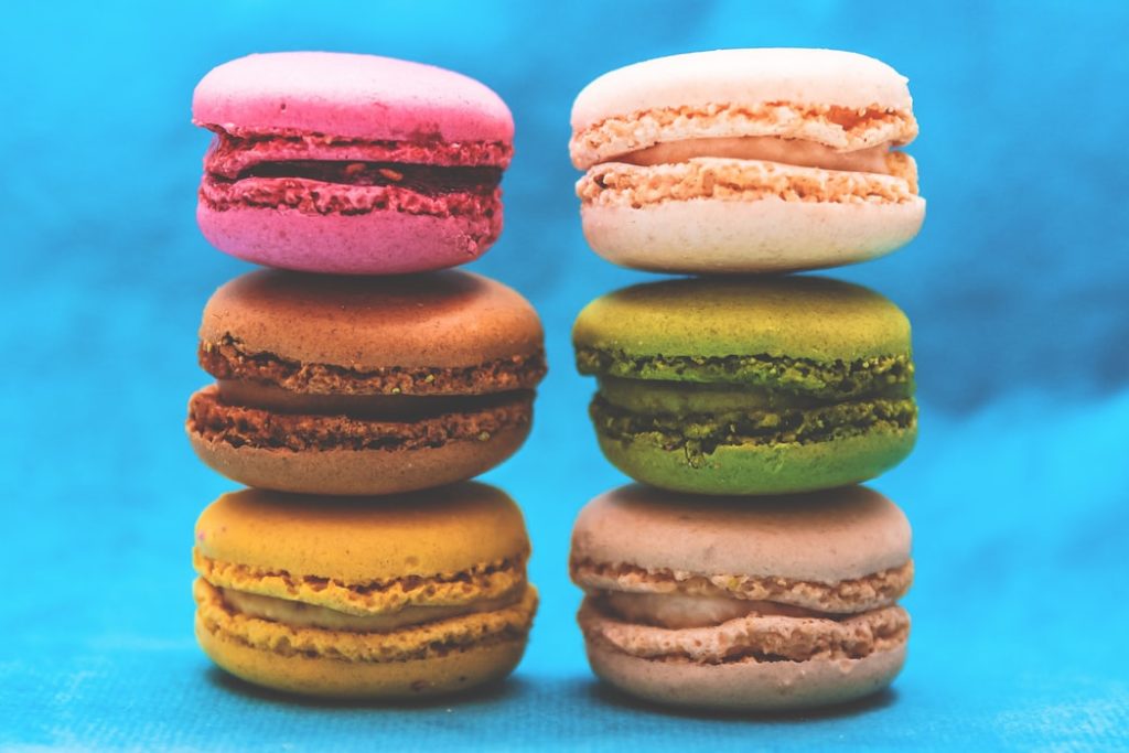 Stack of macarons in front of blue background