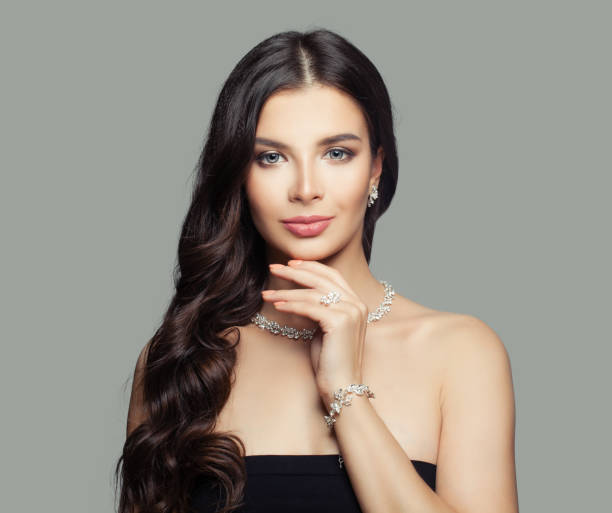 beautiful-woman-with-long-wavy-dark-hair-and-jewelry