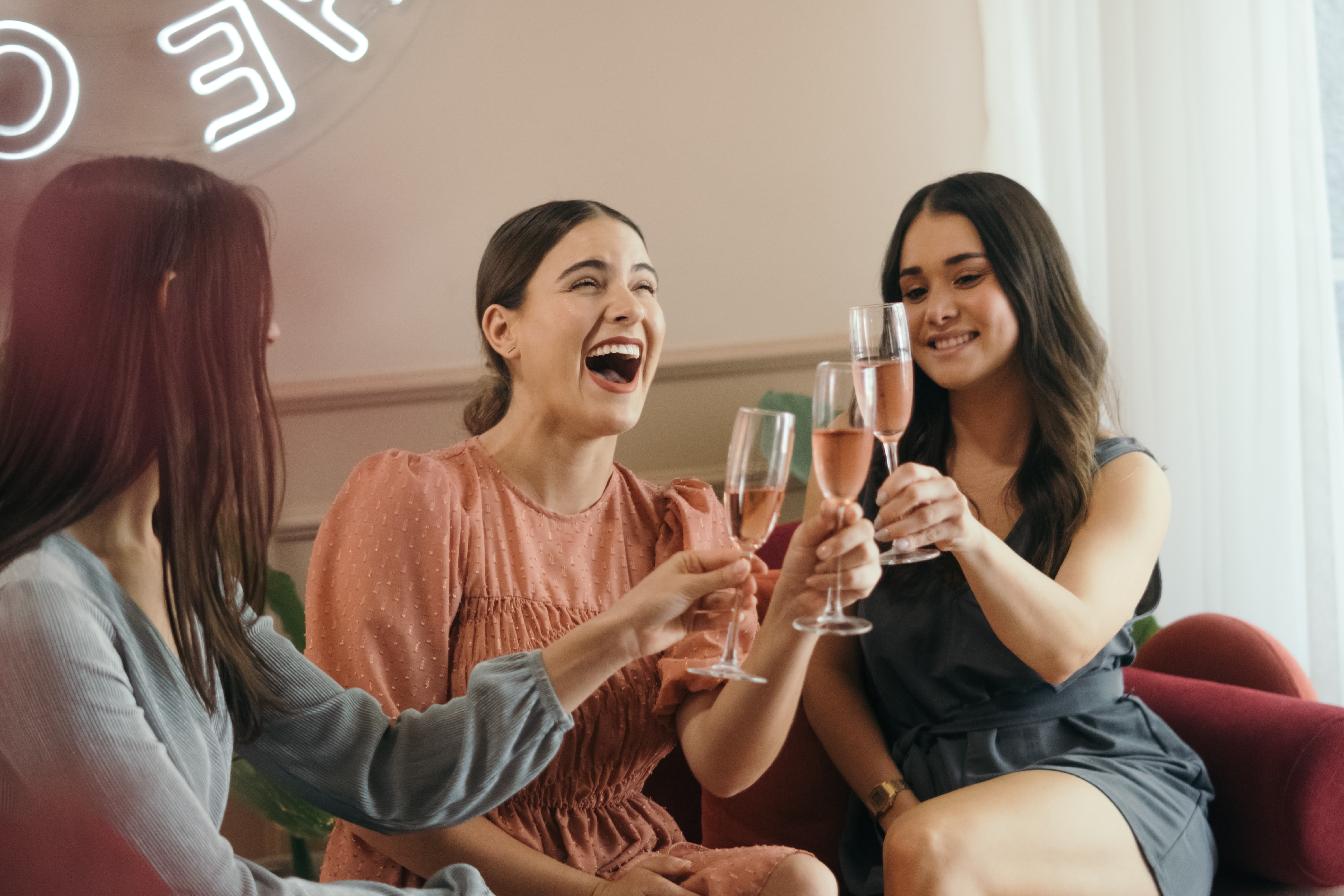 three-women-toasting-with-a-glass-of-rosé-wine