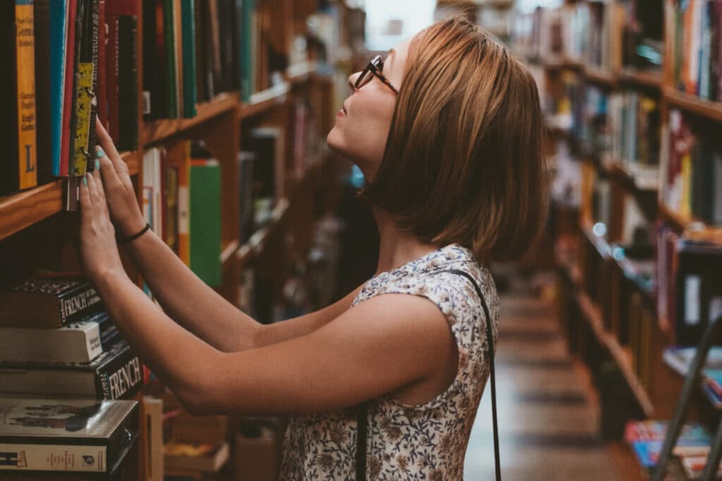 Woman looking at shelves of books