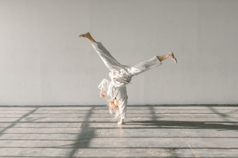 caucasian-woman-doing-martial-arts-handstand-kick