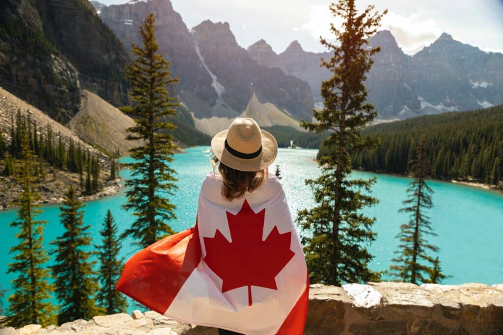 Photo by Andre Furtado: https://www.pexels.com/photo/woman-draped-in-a-flag-of-canada-2916826/
