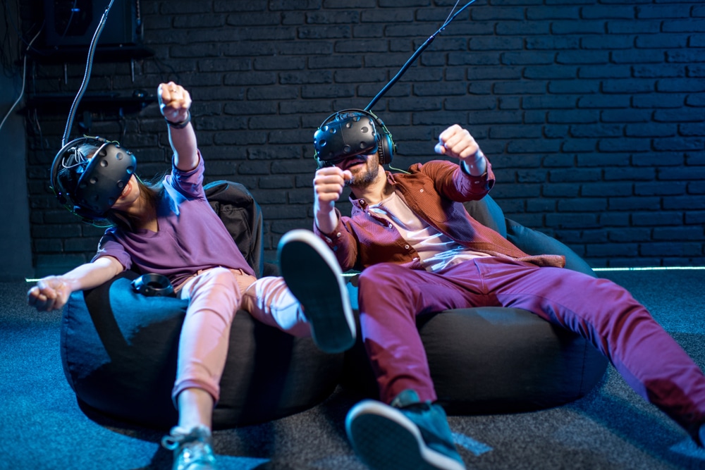 man and woman playing with vr headsets