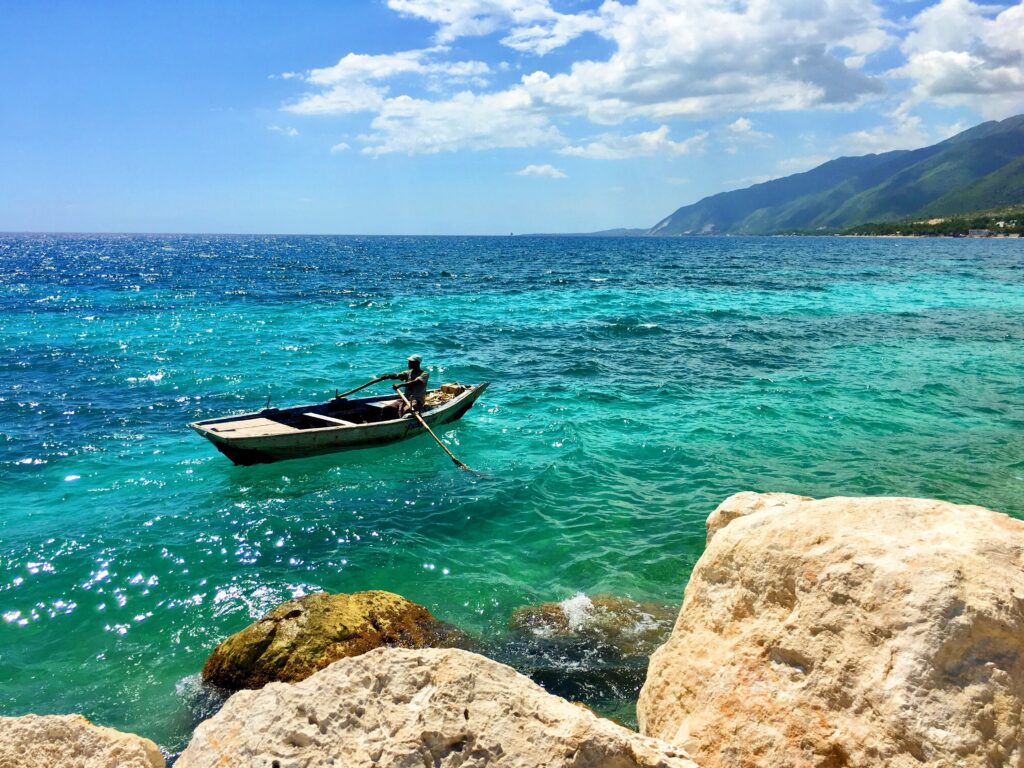 A fisherman in his boat on a bay in Haiti