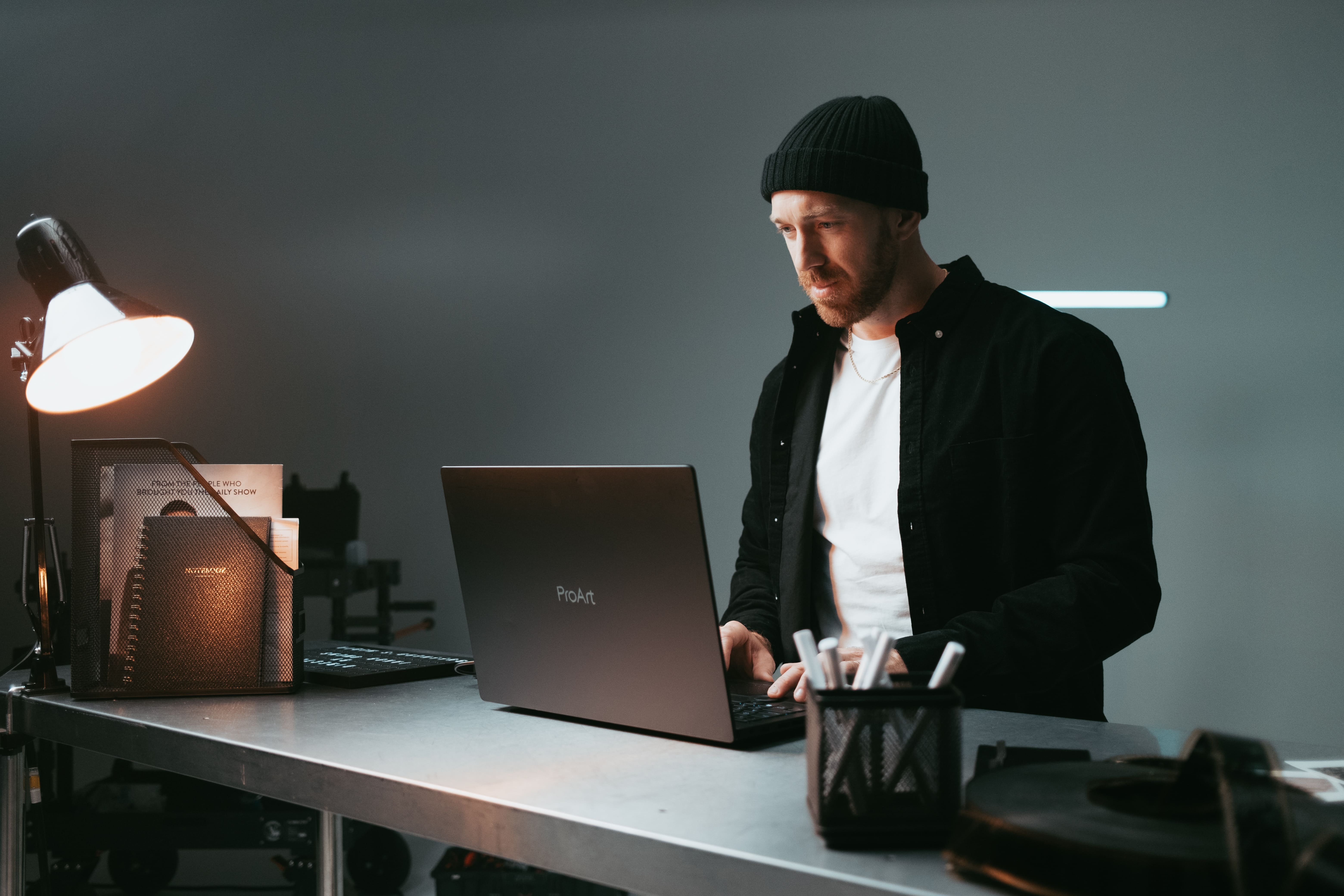 A man edits at his computer station