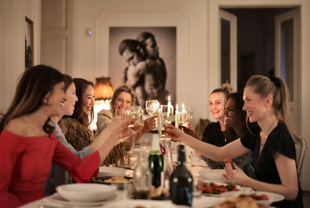 woman-at-dinner-party-making-a-toast-at-the-table