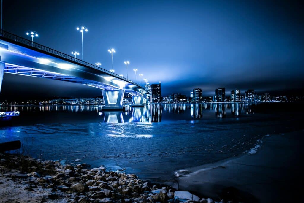 blue-bridge-lit-up-with-lights-at-night