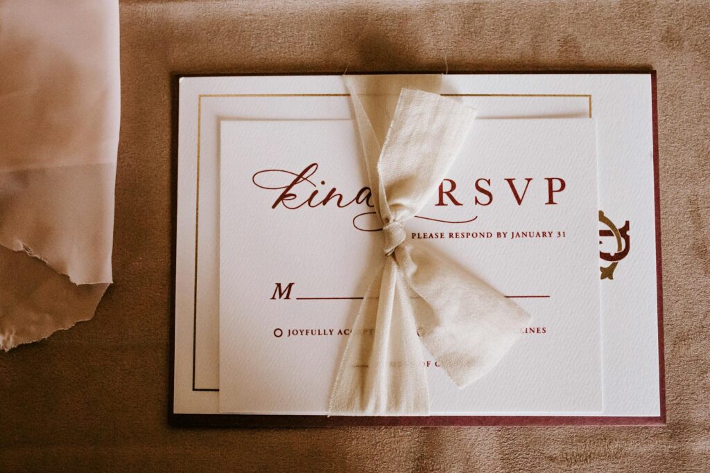 invitation-card-with-white-ribbon-tied-vertically-on-it