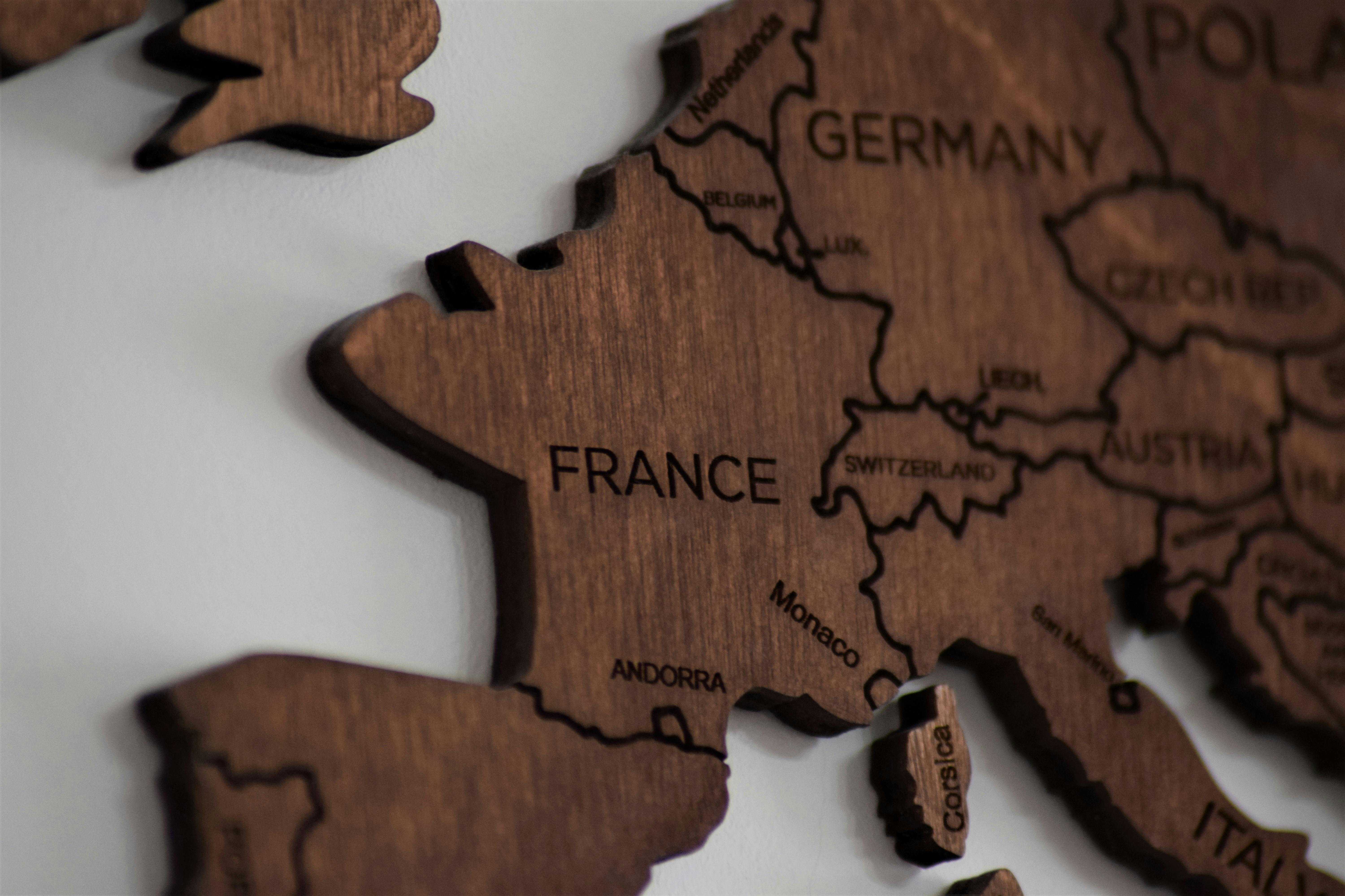 A wooden puzzle of Europe with France featured