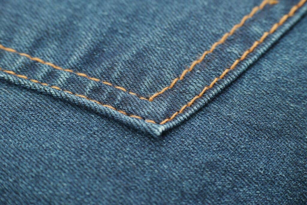 shot-of-blue-denim-cloth-with-brown-stitching