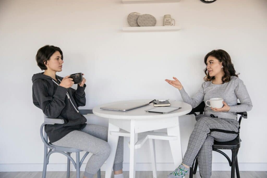 two-women-chatting-with-each-other-over-coffee