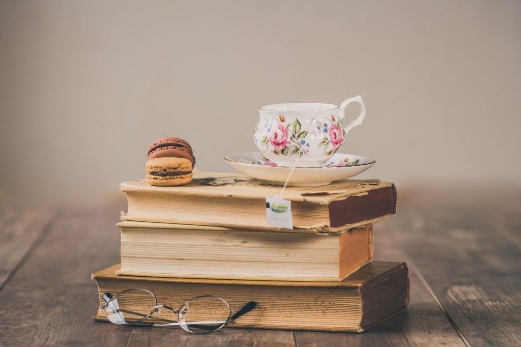 Pile of books with a teacup on top