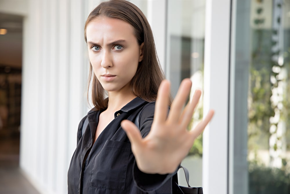 woman-saying-no-or-stop-with-hand-gesture