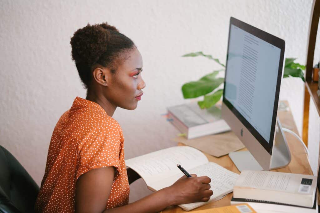 young-woman-writing-at-computer