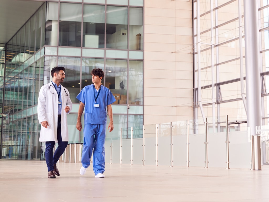 doctor and nurse walking through a hospital